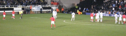 South Korea prepare to take the winning free kick