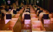 Participants enter a death experience room where they choose a coffin and put on a death robe