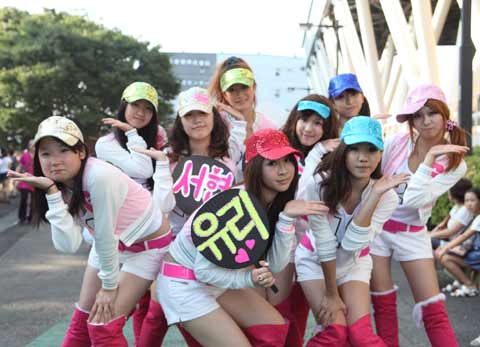 Japanese cosplayers pose as Girls Generation