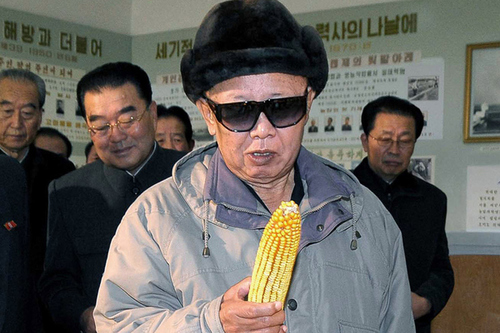 Kim Jong-il looking at corn