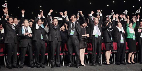 The Korean delegation celebrates