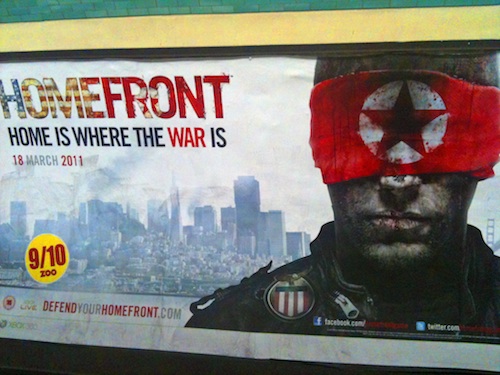 An advertisement for Homefront at Hammersmith tube station, London, May 2011