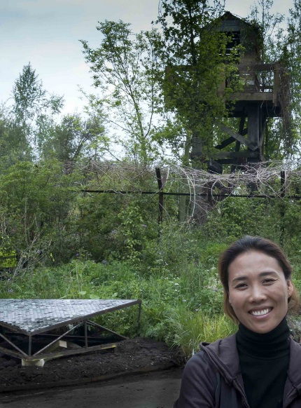 Hwang Jihae in front of her nearly-finished garden