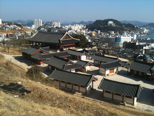 A view of the Tongjeyong from the road near the Chungryeolsa. The Sebyeonggwan is the largest building visible A view of the Tongjeyong from the road near the Chungryeolsa. The Sebyeonggwan is the largest building visible