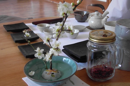 Elegant blossom decorates the tray for the post-lunch tea ceremony Elegant blossom decorates the tray for the post-lunch tea ceremony