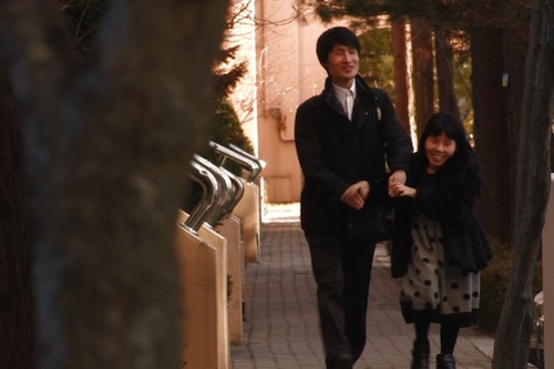Young-chan and Soon-ho chat as they wander down the street Young-chan and Soon-ho chat as they wander down the street