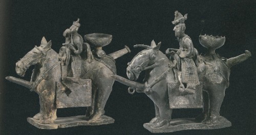 A pair of earthenware figures that were used as vessels for carrying liquids or as lamp holders, excavated from the Gold Bell Tomb in 1924. National Treasure No 91