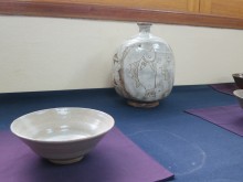 A smaller buncheong vase alongside one of his tea bowls