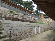 Kimchi jars behind the Sarangchae