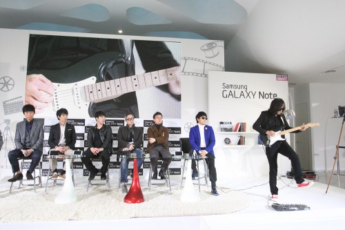 E J-yong (in brown jacket) on stage with collaborators in the Cine Note project.