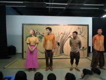 Some of the cast acknowledge the audience's applause