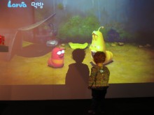 A young visitor is entertained by some of the animation