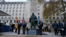War veterans beside the memorial