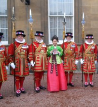 Sylvia Park with Yeoman of the Guard at Buckingham Place