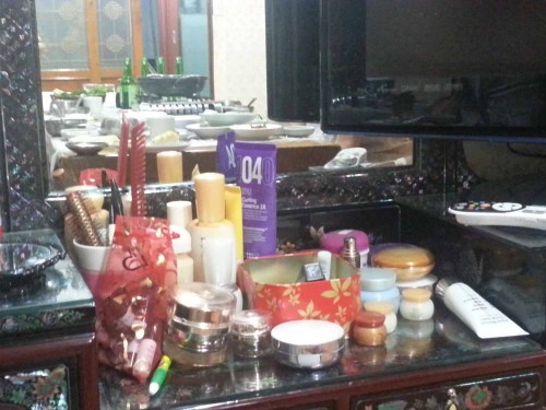 The remains of our dinner are reflected in the dressing table mirror
