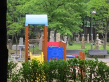 Some of the better-preserved funerary statues have been incongruously gathered together in a children's playground