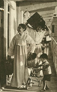 A family moving into a newly built, modern flat in Pyongyang, 1958