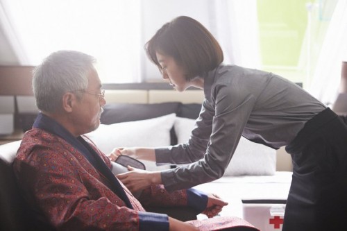 Lee Kyeong-yeong as the tycoon, with Im Soo-jeong as his carer and would-be wife