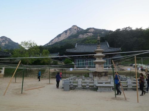 5:50am: the first visitors of the day engage in silent meditation as they circle Bongamsa's 3-storey stone pagoda, treasure # 169