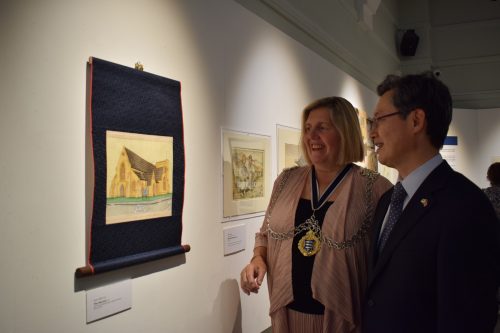 Cllr Julie Pickering (Mayor of Kingston) and Ambassador Hwang view artwork in Kingston Museum's latest exhibition