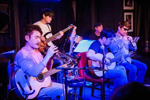 The full band play the third set