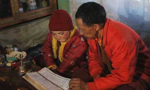 A monk teaches a young novice