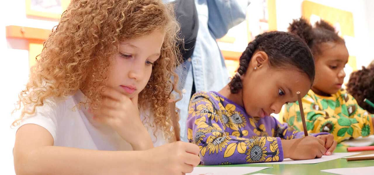 Children practising calligraphy