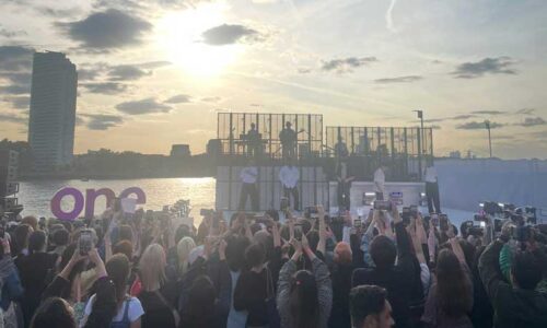 The performance stage against a setting sun