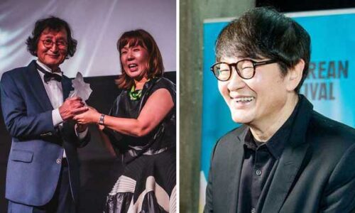 Two smiling film directors