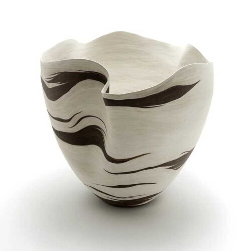 A wavy vase or bowl formed out of leather