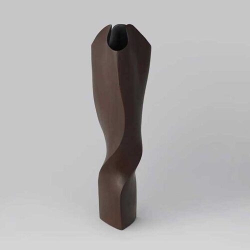 A tall, dark, twisted ceramic sculpture