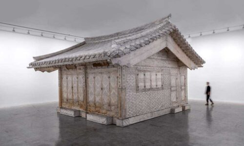 An installation representing a Korean hanok in an art gallery