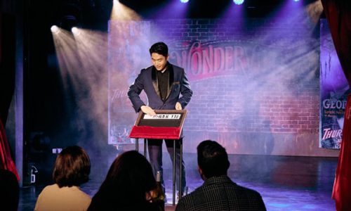 Yollin Lee - a magician performing on stage